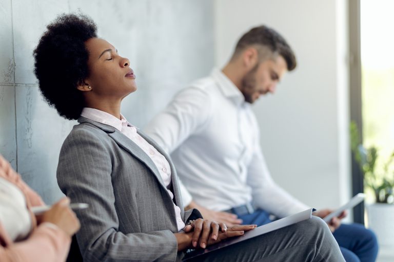 African American Businesswoman trying concentrate while waiting job interview