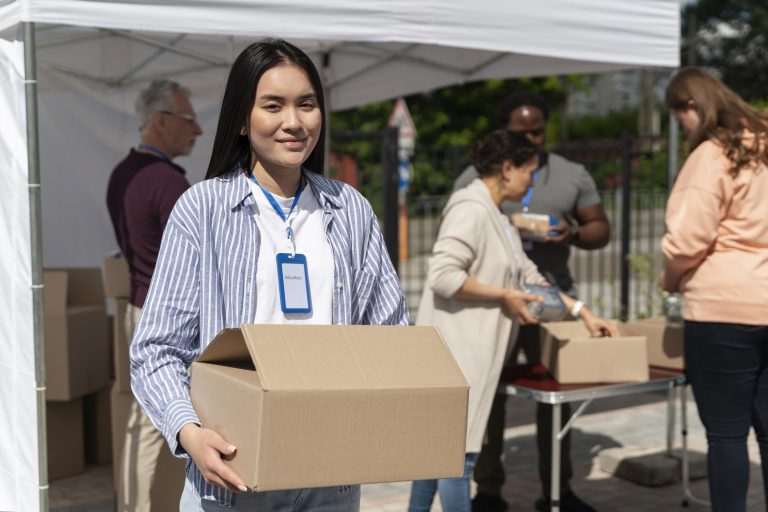 group people volunteering foodbank poor people